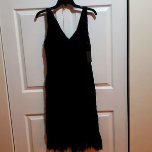 Black lace DKNY dress  size 4 - never worn.  Black lace overlay. Mermaid style